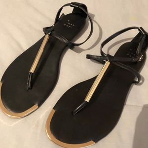 Black and gold thong sandals